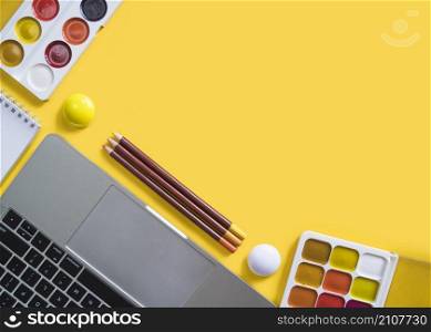 laptop paints yellow surface