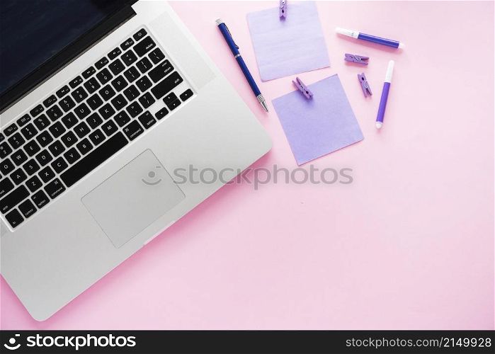laptop supplies with pink background