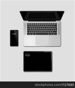 Laptop, tablet and phone set mockup isolated on grey background with blank screens. 3D render. Laptop, tablet and phone set mockup isolated on grey. 3D render