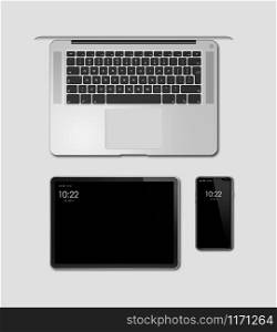 Laptop, tablet and phone set mockup isolated on grey background with blank screens. 3D render. Laptop, tablet and phone set mockup isolated on grey. 3D render