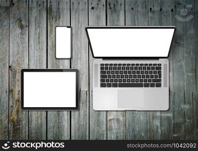 Laptop, tablet and phone set mockup on a wooden desk background. 3D render. Laptop, tablet and phone set mockup on a wooden background. 3D render