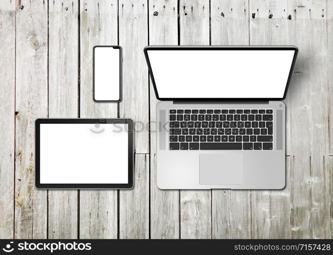 Laptop, tablet and phone set mockup on a wooden desk background. 3D render. Laptop, tablet and phone set mockup on a wooden background. 3D render