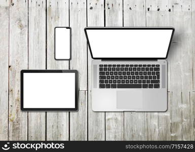 Laptop, tablet and phone set mockup on a wooden desk background. 3D render. Laptop, tablet and phone set mockup on a wooden background. 3D render
