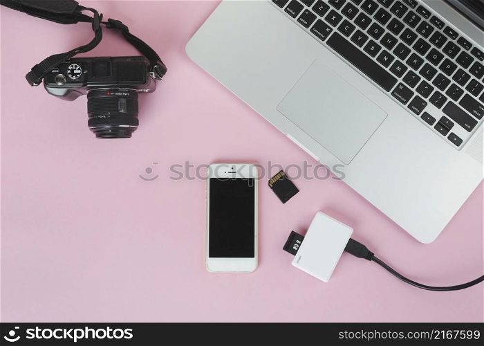 laptop with camera sd card pink table
