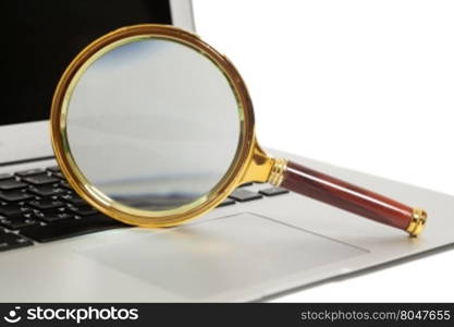Laptop With Magnifying Glass isolated on white