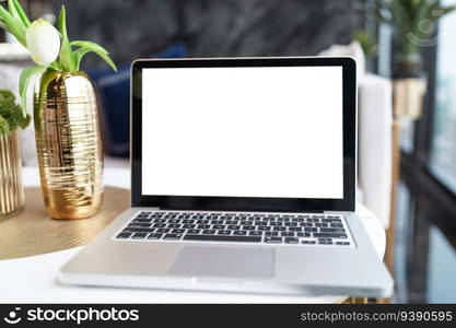 Laptop with Mock up blank screen on table in front of cafe space for text. product display computer laptop montage- technology concept.