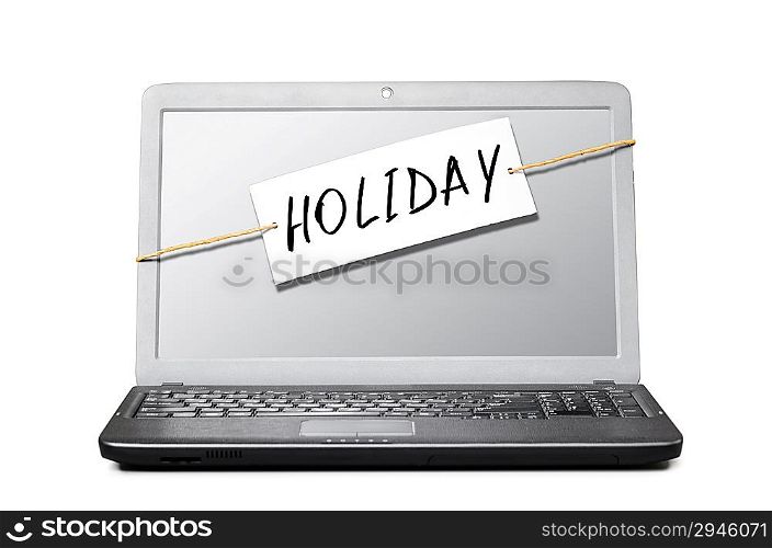 laptop with note about holiday isolated on white