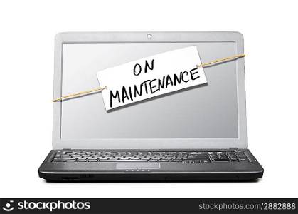laptop with note about maintenance