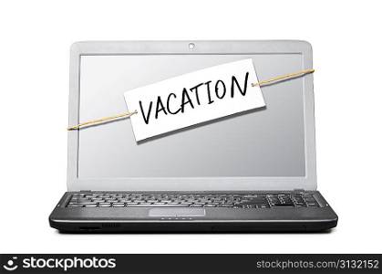 laptop with note about vacation isolated on white