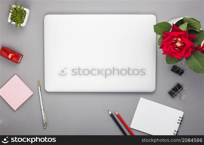 laptop with notepad table