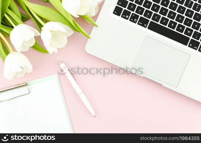 laptop with tulips clipboard table. High resolution photo. laptop with tulips clipboard table. High quality photo