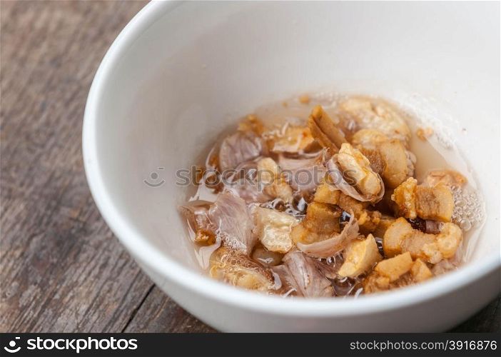 lard and garlic fry in white bowl