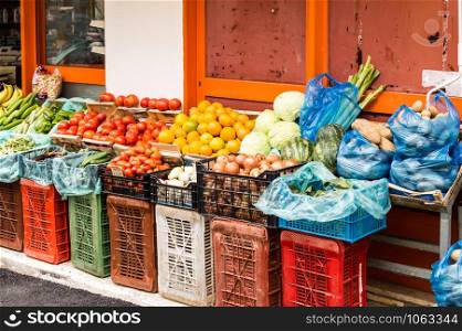 Large amount of fruits displayed in a market with many colors and variety