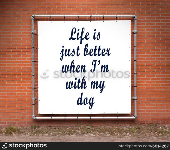 Large banner with inspirational quote on a brick wall - Life is better when I'm with my dog