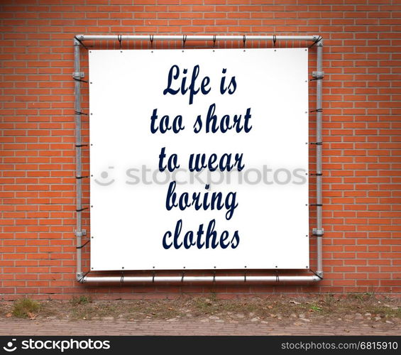 Large banner with inspirational quote on a brick wall - Life is to short to wear boring clothes