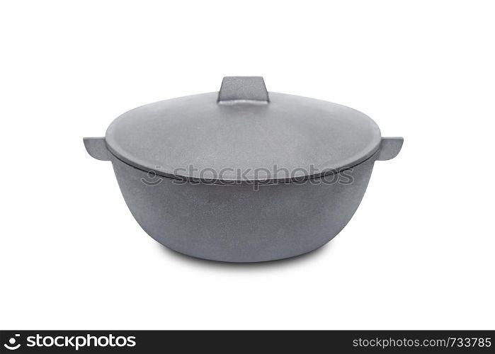 Large black cast iron pan with opened lid on white background. Isolated on white background. With clipping path