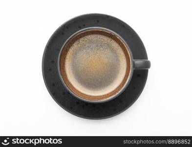 Large black coffee in porcelain cup with saucer on white. Top view.