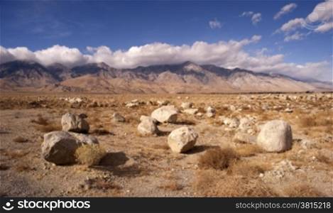 Large boulders dominate the scene on the floor in Death Valley