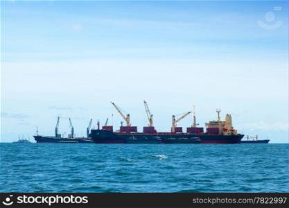 large cargo ship. Moored offshore. The import and export of goods waiting.