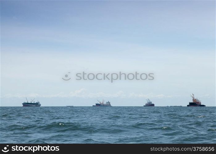 large cargo ship. Moored offshore. Transport near the docks.