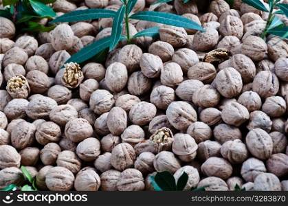 Large collection of walnuts sold at large market in Fethiye, Turkey