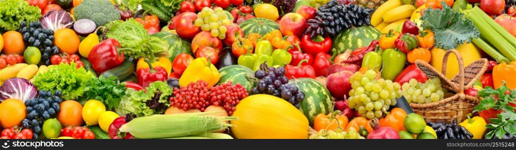 Large colorful wide background of fresh and healthy vegetables and fruits.