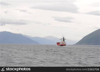Large commercial boat in norvegian fjords