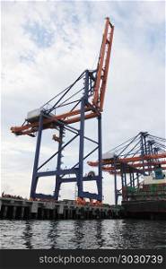 Large crane for loading and unloading.. Large crane for loading and unloading in sea port on the day time.