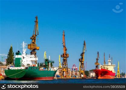 Large cranes on a pier in the seaport of Gdansk.. Gdansk. Sea port.