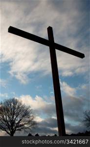 large cross against great cloudy winter sky on Birkenkopf mountain in Stuttgart, Germany