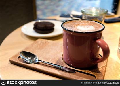 large cup of cocoa on a table in a cafe