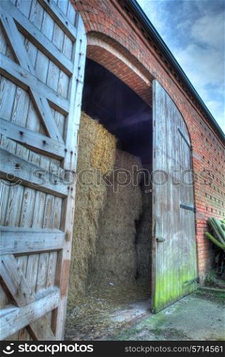 Large double doors set into brick constructed hay barn, Worcestershire, England.