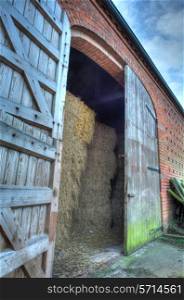 Large double doors set into brick constructed hay barn, Worcestershire, England.