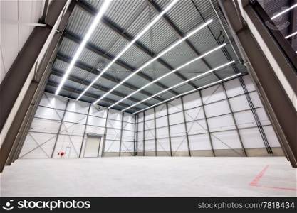 large, empty warehouse interior made from prefab parts