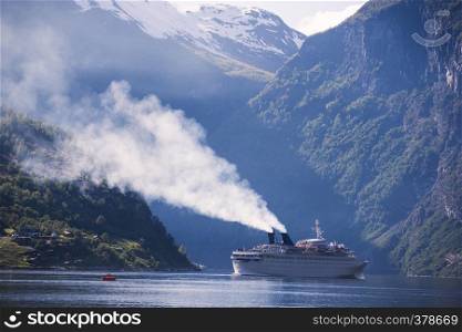 large ferry in the most beautiful Geiranger fjord in Norway