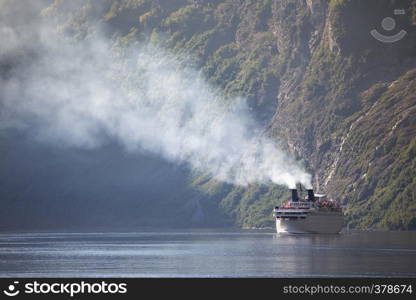 large ferry in the most beautiful Geiranger fjord in Norway