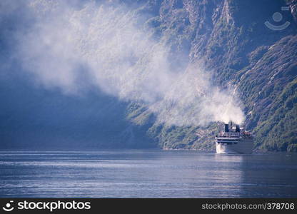 large ferry in the most beautiful Geiranger fjord in Norway