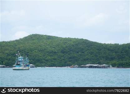 Large fishing boats. Float in the sea. Adjacent Villa Resort.