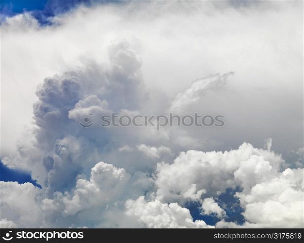Large fluffy clouds in sky.