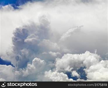Large fluffy clouds in sky.