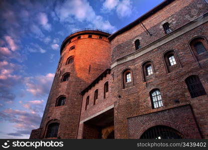 Large fortress in Gdansk, Poland against blue sky.