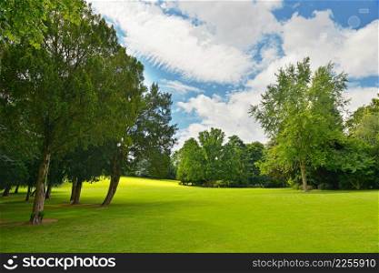 Large golf course in beautiful summer park