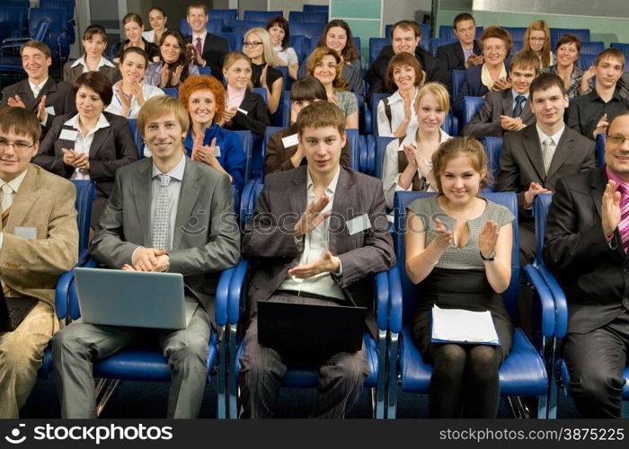 Large Group of Business People Sitting at the Conference Call and Applauding