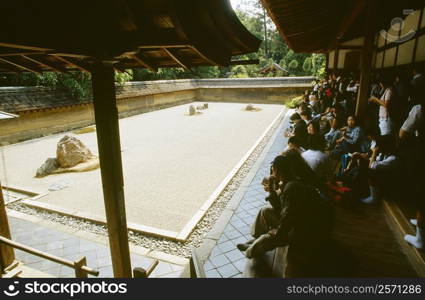 Large group of people in a rock garden, Ryoanji temple, Kyoto, Japan