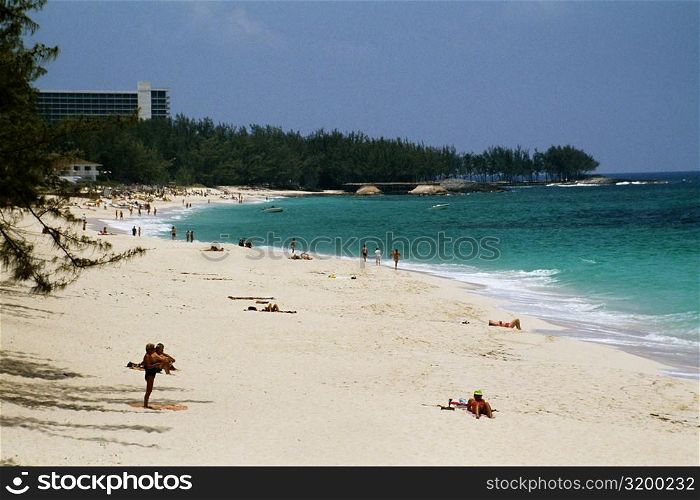Large group of people sunbathing along the seacoast, Paradise Island, Bahamas
