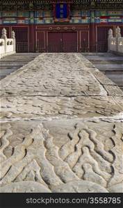 Large hand crafted sidewalk leading into temple at Forbidden City of China