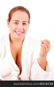 Large happy woman offering a spa business card