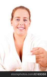 Large happy woman offering a spa business card