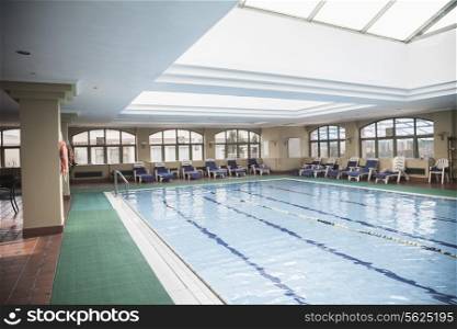 Large, indoor swimming pool with skylight.