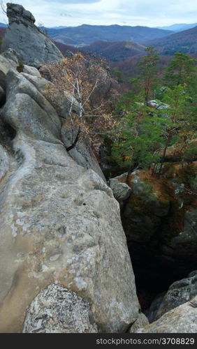 "Large lofty stones in autumn forest ("Skeli Dovbusha" , Ivano-Frankovsk Region, Ukraine)"